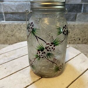 Decorative Glass Jar with Pinecone Design